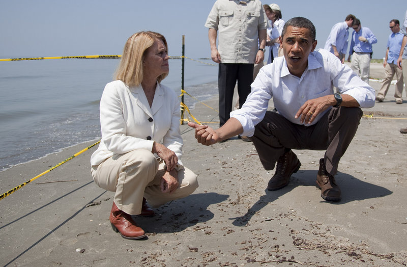 President Obama and LaFourche Parish President Charlotte Randolph discuss small, oily tar balls found on the beach in Port Fourchon, La., on Friday.