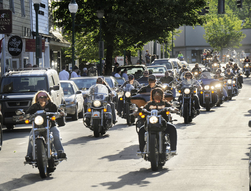 Motorcyclists thunder down Water Street to usher in Hogs, Pies and Fireworks on Friday evening.