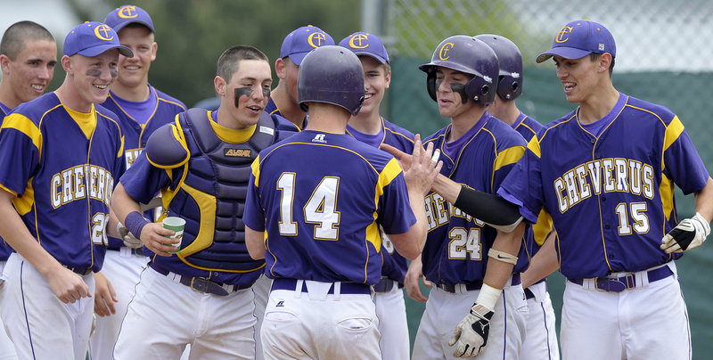 Jack Bushey of Cheverus is welcomed by teammates Saturday after hitting a home run to lead off the second inning of a 4-1 victory against Biddeford. Cheverus scored three runs in the first and held off Biddeford in a game between teams competing for a playoff berth in Western Class A.