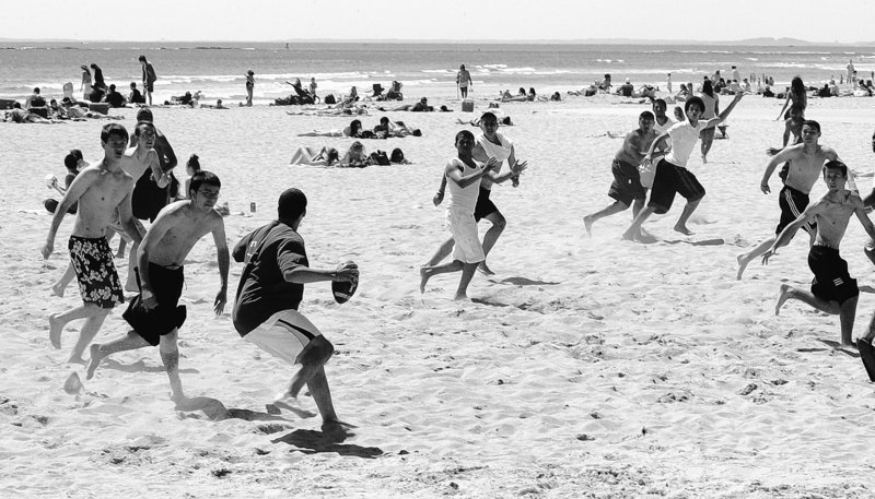High school students on a field trip play football at Hampton Beach, N.H. For years the beach has drawn high school and college students, families and retired couples. The state has only 18 miles of seacoast but Hampton Beach is a jewel getting a $14.5 million facelift.