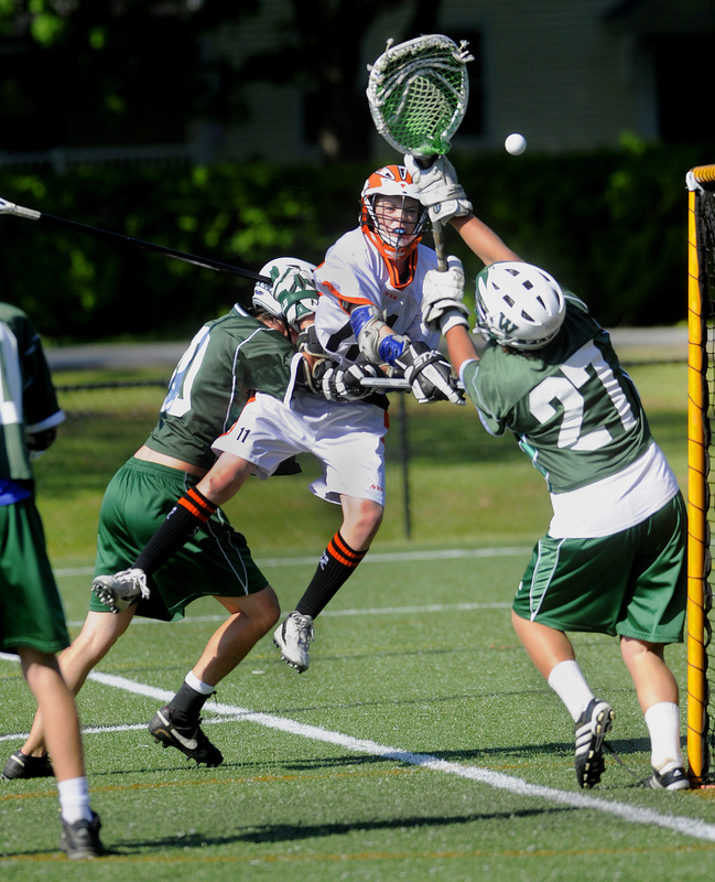Waynflete goalie Will Hallett, right, makes one of his 24 saves Tuesday to stymie Matt Kibler of North Yarmouth Academy during Waynflete’s 15-8 victory. Waynflete is attempting to pass York and reach the postseason.