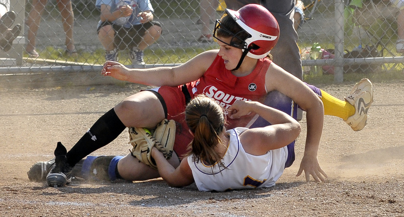 Cheverus pitcher Theresa Hendrix holds onto the ball Wednesday while tagging out Brittany Harrison of South Portland, who was attempting to score a second run on a ball that rolled away. South Portland took advantage of Cheverus’ faulty defense to earn a 10-6 victory.