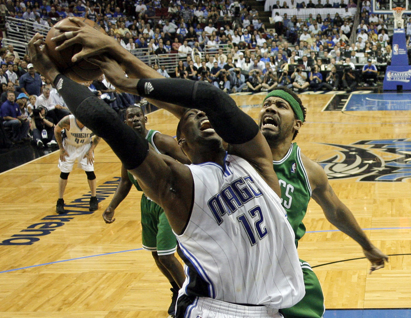 Dwight Howard of the Orlando Magic has a shot blocked by Rasheed Wallace of the Boston Celtics during Orlando’s 113-92 victory Wednesday night in Game 5 at home.