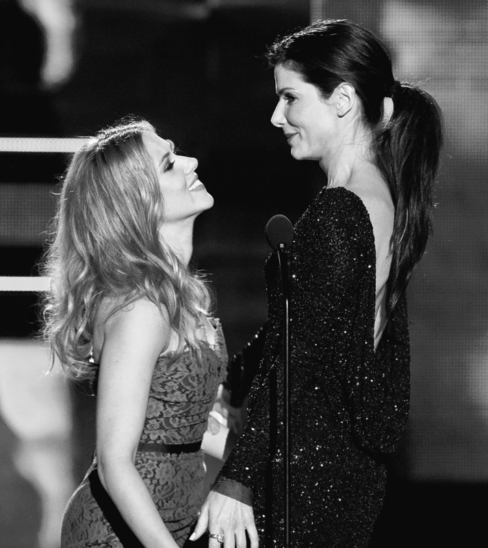 Scarlett Johansson, left, and Sandra Bullock appear onstage together Sunday at the 2010 MTV Movie Awards, where Bullock was honored with the MTV Generation Award.