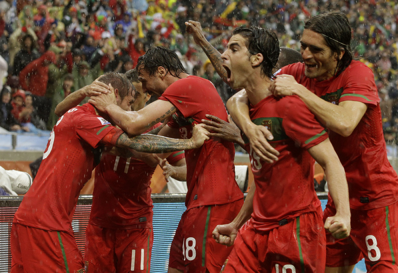 Raul Meireles, left, celebrates with his Portuguese teammates after scoring a first-half goal Monday against North Korea. Portugal added six more goals in the second half, all but guaranteeing advancement to the second round.