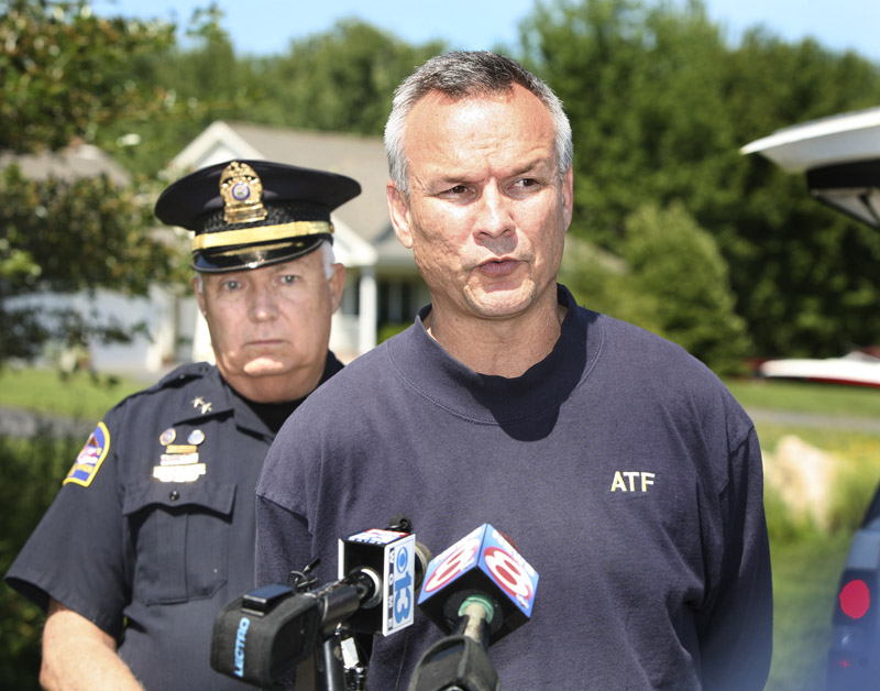 Glen "Andy" Anderson, ATF special agent in charge of the Boston field office, right, and Old Orchard Beach Chief of Police Dana Kelley address the media in Scarborough after the ATF raided a home on Sandy Circle in Old Orchard Beach this morning.
