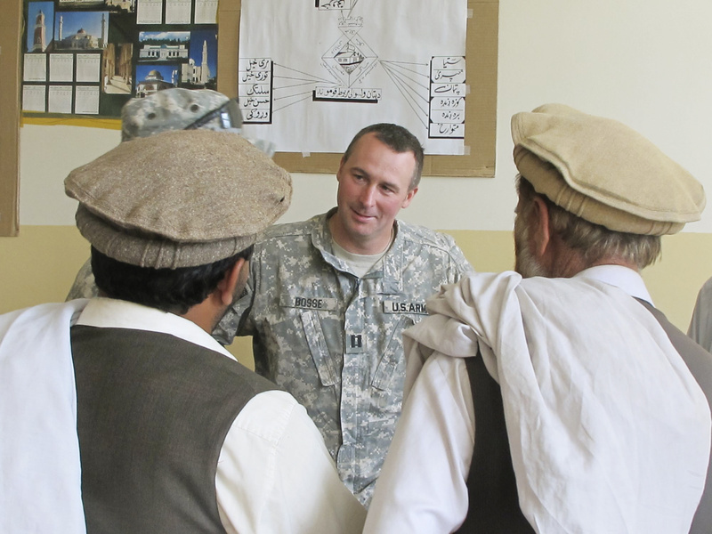 Capt. Paul Bosse of Auburn, a Maine Army National Guard commander, listens to requests for help during Monday’s weekly “shura,” or meeting, with local Afghan elders at the District Center in Dand wa Patan, Afghanistan.