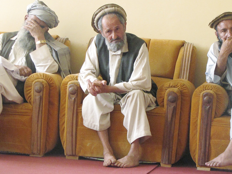 A village elder listens to the discussion during the weekly “shura,” where leaders compare notes, talk about what’s working and what isn’t, and, most of all, complain.