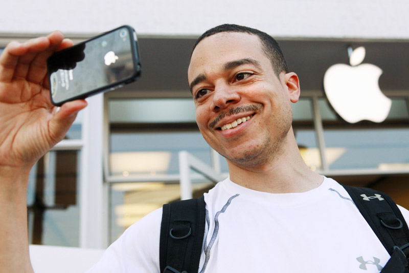 Thomas Smith, 32, of Boston, tries out the video on his new iPhone after standing in line outside the Apple Store in the Georgetown neighborhood of Washington, D.C., today. "This is going to be the talk of the office today," says Smith.