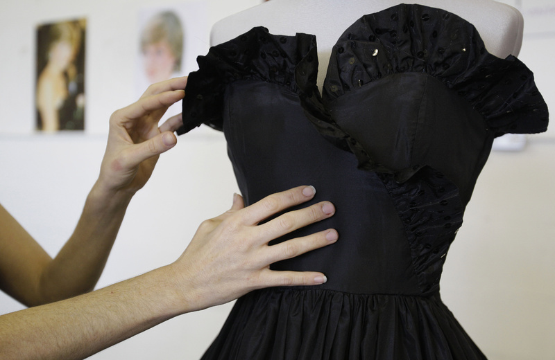 A black taffeta evening gown worn by Princess Diana is displayed, at an auction house in London. The dress is expected to fetch between $44,000 to $73,000.