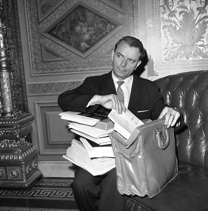 In this 1964 file photo, Sen. Robert C. Byrd repacks his briefcase after keeping the senate in a round-the-clock session with a more than 15-hour speech. The 46-year-old foe of the civil rights bill said he made his marathon speech in hope of defeating efforts to cut off debate on the bill. briefcase,democrat,politician,politics,senator