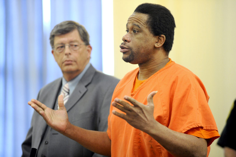 Rennie Cassimy, who pleaded guilty earlier this year to conspiracy for his role in the 2008 murder of Winston George in Old Orchard Beach, is seen here next to his attorney Cliff Strike as he speaks to York County Superior Court Justice G. Arthur Brennan.