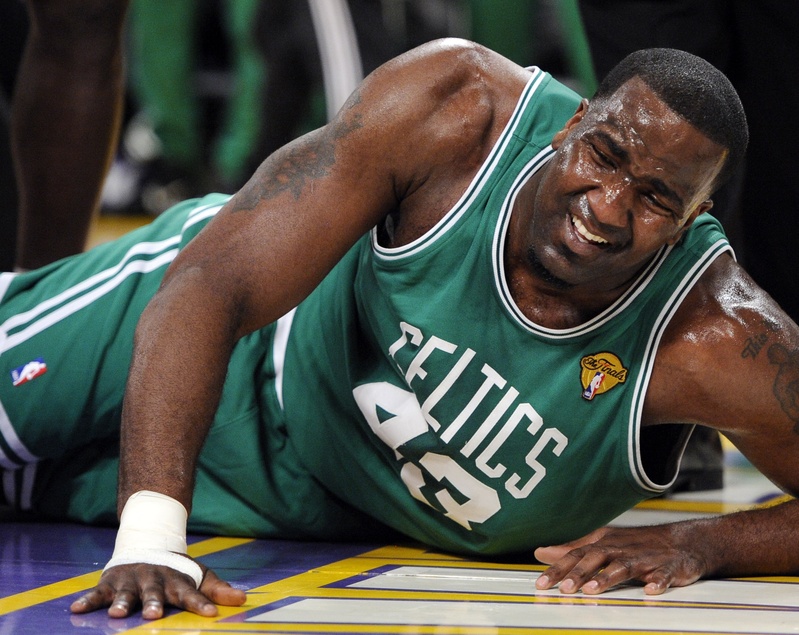Boston center Kendrick Perkins goes down after suffering a knee sprain Tuesday in the first half of Game 6 of the NBA finals against the Lakers in Los Angeles. The Lakers beat the Celtics, 89-67, forcing a title-deciding Game 7 on Thursday in L.A.