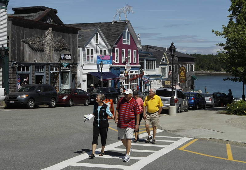 Tourists stroll through Bar Harbor during a visit by the cruise ship Maasdam on June 4. “The last two or three years, we’ve really spiked,” said harbor master Charlie Phippen.