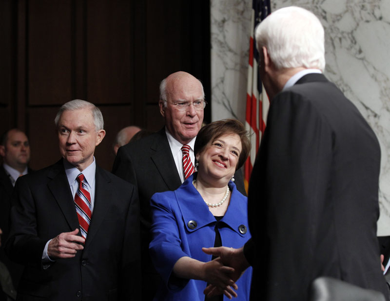 Supreme Court nominee Elena Kagan is escorted by the Senate Judiciary Committee's ranking Republican Sen. Jeff Sessions, R-Ala., left, and committee Chairman Sen. Patrick Leahy, D-Vt., second from left, as she arrives on Capitol Hill today for her confirmation hearings.