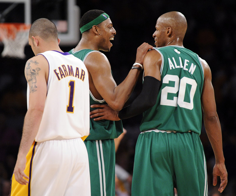 Boston Celtics guard Ray Allen (20) reacts with Paul Pierce (34) as Los Angeles Lakers guard Jordan Farmar walks by late in the second half of Game 2 of the NBA basketball finals Sunday in Los Angeles. The Celtics won 103-94.