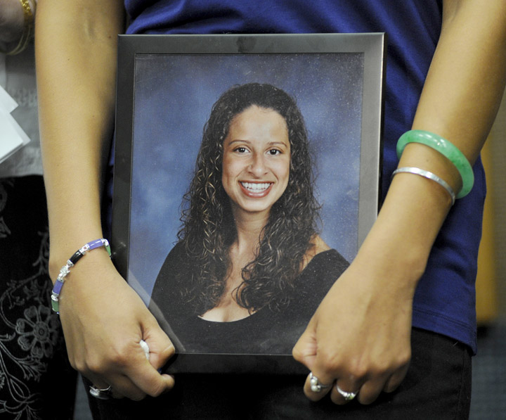 In this file photo, Sarena Richardson holds a picture of her sister Darien during a press conference at the Portland Police Department on May 13 2014. Darien Richardson suffered a gunshot wound during a home invasion and died two months later of a blood clot.