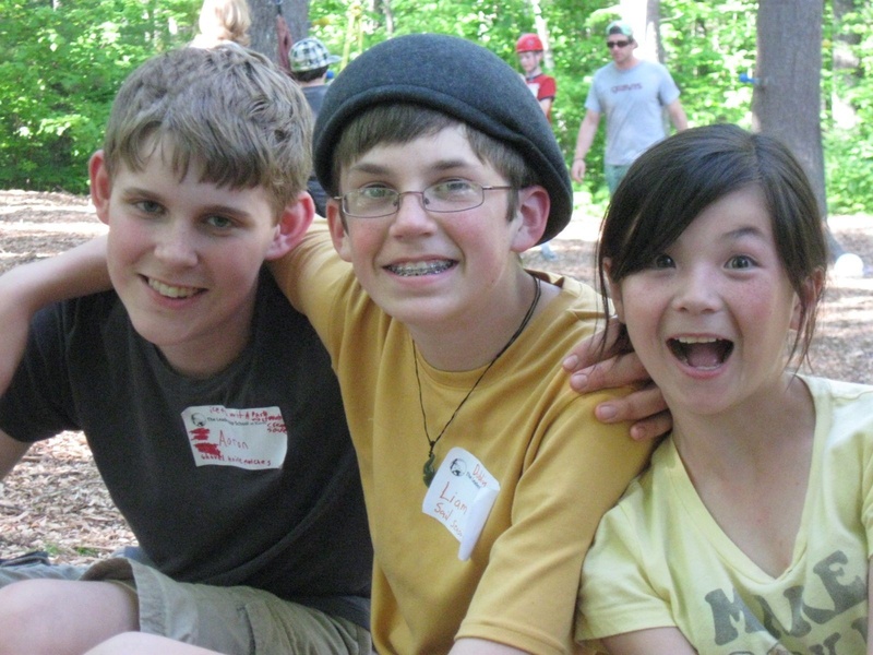 Aaron Gallant, Liam Wade and Danielle Morency get ready to climb the ropes course at The Leadership School at Kieve.