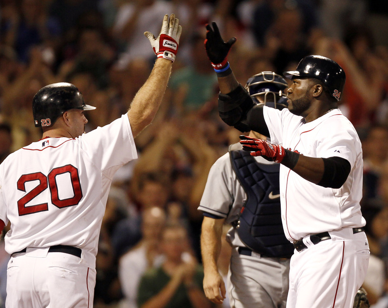 David Ortiz, right, is welcomed by Kevin Youkilis after hitting a three-run homer in the fifth inning Tuesday night, snapping a scoreless tie and starting the Boston Red Sox to an 8-5 victory against the Tampa Bay Rays at Fenway.