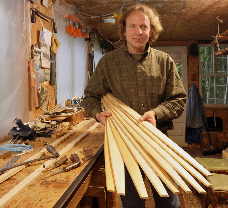 Steve Cayard in his workshop in Wellington with cedar ribs that will be soaked and bent for the framework of a birch canoe he is building in the traditional American Indian fashion.