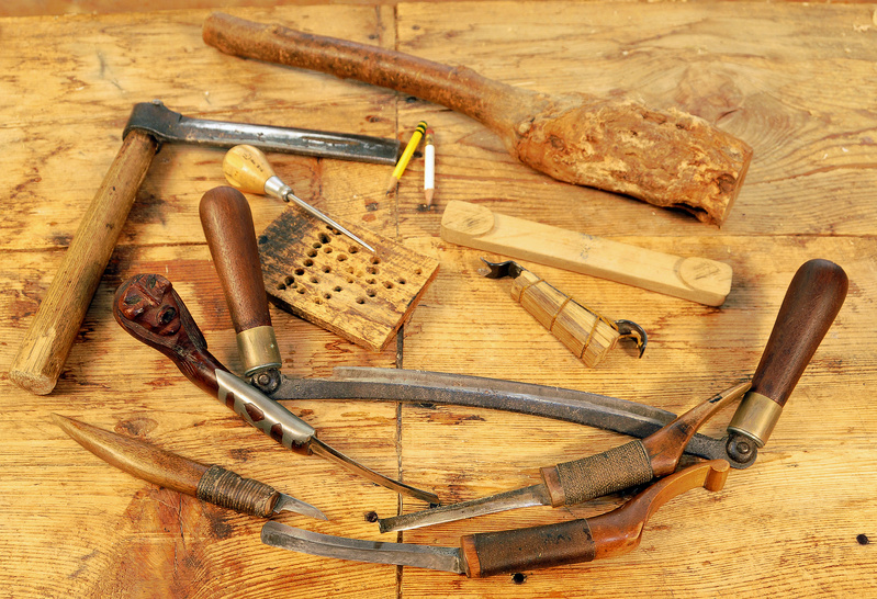 Steve Cayard's hand tools, include a froe, left, for splitting the cedar using a maul, top, and a variety of draw and crooked knifes.