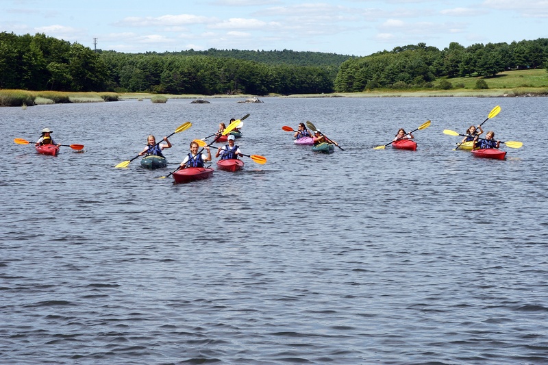 Young kayakers take part in a program last August at Chewonki in Wicasset. New adventures are planned for this summer.