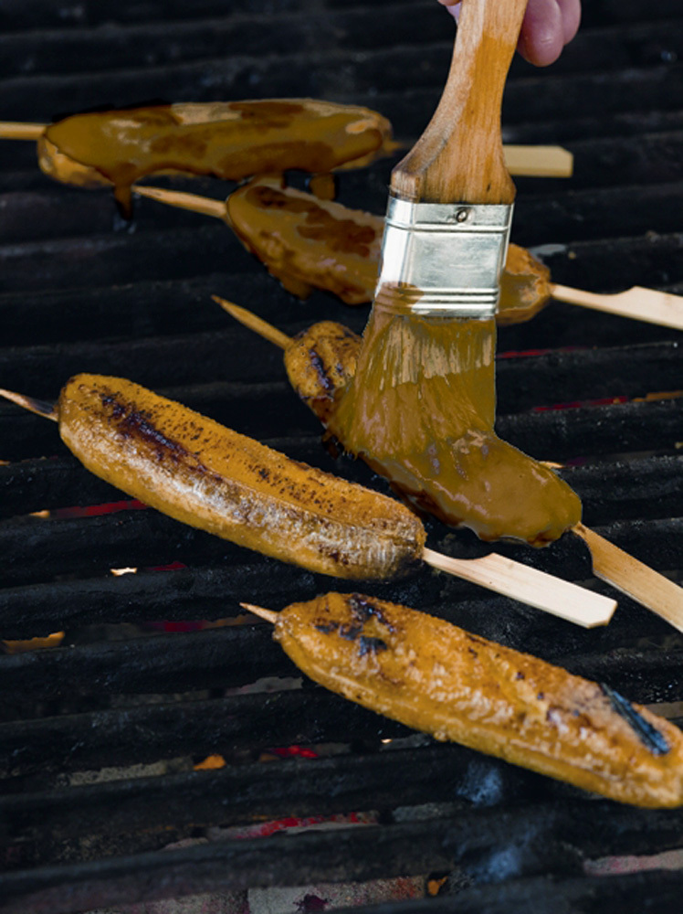 Steven Raichlen's Bananas with Coconut-Caramel Sauce warm on the grill.
