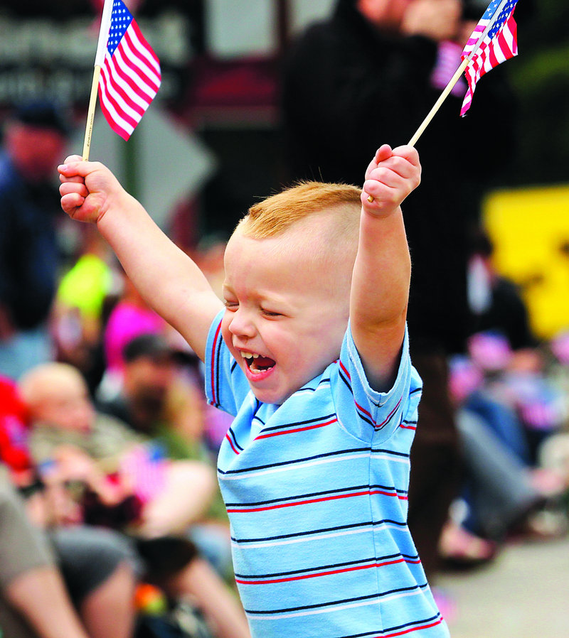 Van Lester, 2, of Brunswick shows his excitement as the parade approaches Monday. This holiday may mark the final time Brunswick Naval Air Station sailors participate in the Brunswick-Topsham Memorial Day festivities.
