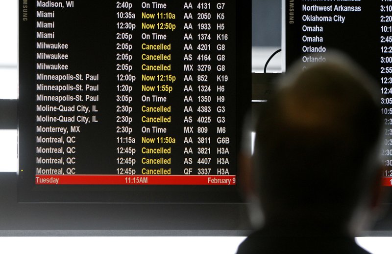 An American Airlines passenger checks the departure board at Chicago’s O’Hare Airport. In the first three months of 2010, American Eagle, American Airlines’ regional affiliate, was the most likely to bump passengers; JetBlue has been the least likely.