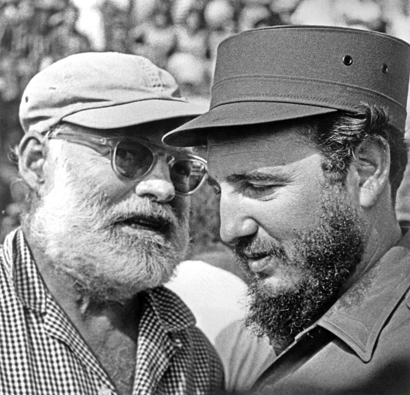 Ernest Hemingway talking to Fidel Castro in an undated photo.
