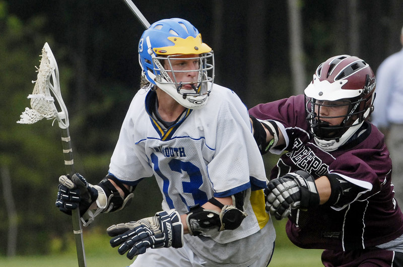 Nick Backman of Falmouth drives down the field Tuesday while defended by Josh Sturtevant of Freeport during their schoolboy lacrosse game at Falmouth. Falmouth ended the regular season with a 10-2 record following a 15-2 victory.