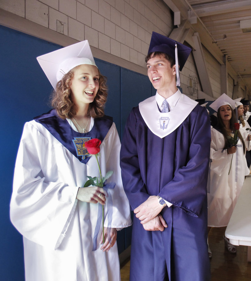 Corey Carmichael, valedictorian, and Tim Weber, salutatorian, wait in Portland High's gym to march to Merrill Auditorium for their graduation ceremony Wednesday.