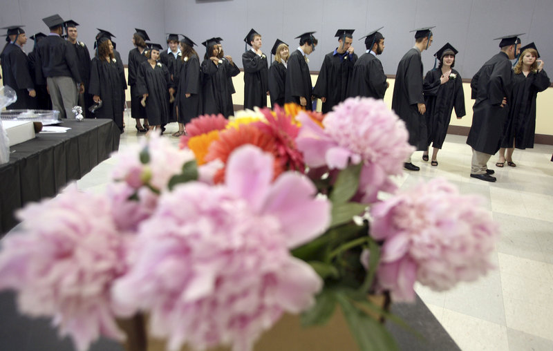 Casco Bay High School seniors line up before the start of their graduation Wednesday at Merrill Auditorium in Portland.
