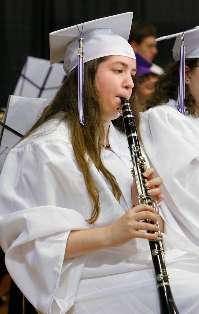 Deering High School senior Alex Jackson plays the clarinet while performing “The Maelstrom” with the Deering High School Concert Band during Deering’s graduation ceremony.