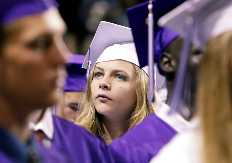 Deering High School senior Shelby LaPierre scans the crowd in the Portland Expo before Deering’s graduation ceremony begins on Thursday.
