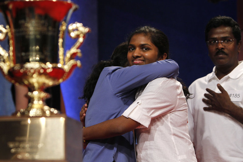Anamika Veeramani, 14, of North Royalton, Ohio, is congratulated by her parents Friday after winning the 2010 National Spelling Bee in Washington, D.C. Veeramani correctly spelled the medical word “stromuhr” for the victory.