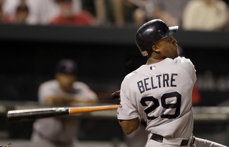 Adrian Beltre watches the flight of his home run Friday night in Baltimore. Marco Scutaro also homered and scored three runs.