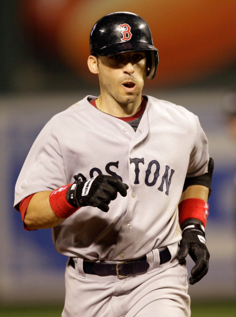 Boston’s Marco Scutaro rounds the bases after hitting a solo homer in the eighth inning Friday night. He scored three runs in the 11-0 win.