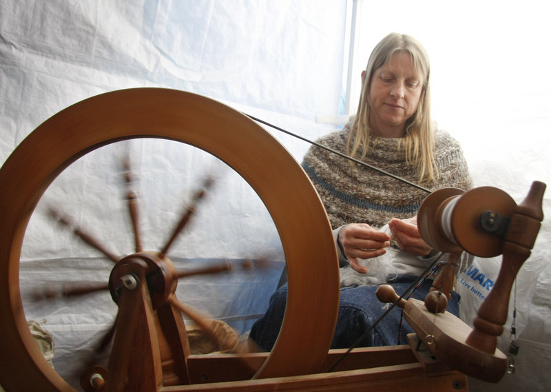 Karen Cornell of CrowsRise Farm in Anson spins English Angora wool.