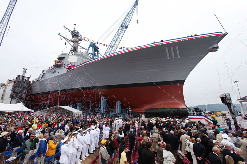 The USS Spruance looms over the crowd at its christening ceremony on Saturday at Bath Iron Works. The Aegis destroyer’s namesake commanded a battle group with two of three U.S. aircraft carriers whose warplanes sank four Japanese carriers at the Battle of Midway, hailed as the turning point in World War II in the Pacific. Adm. Raymond Spruance was remembered by family as a “mischievous, fun” grandfather.