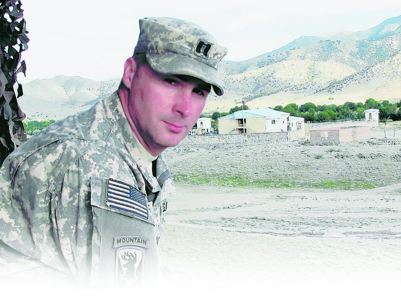 Capt. Paul Bosse of Auburn, who commands the Maine Army National Guard’s Bravo Company, stands before an Afghanistan Border Police compound marking the Pakistan border.
