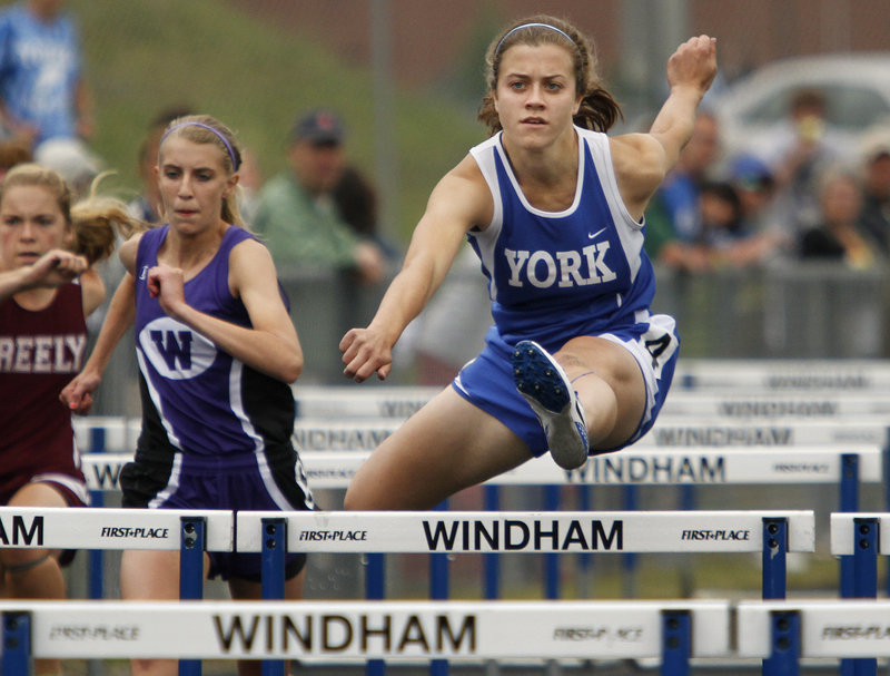 Stephanie Lomasney of York has her eyes on the finish during the 100-meter hurdles. Lomasney finished third in 15.35 seconds. Allison Fereshetian of Leavitt won in 14.72.