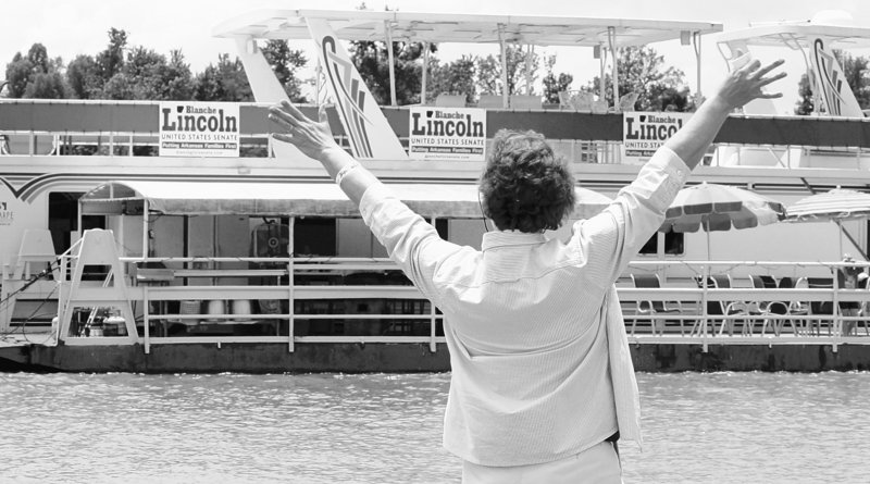U.S. Sen. Blanche Lincoln, D-Ark., waves to a houseboat displaying her campaign signs on the White River in Jacksonport, Ark., on Saturday. Lincoln faces a primary challenge.
