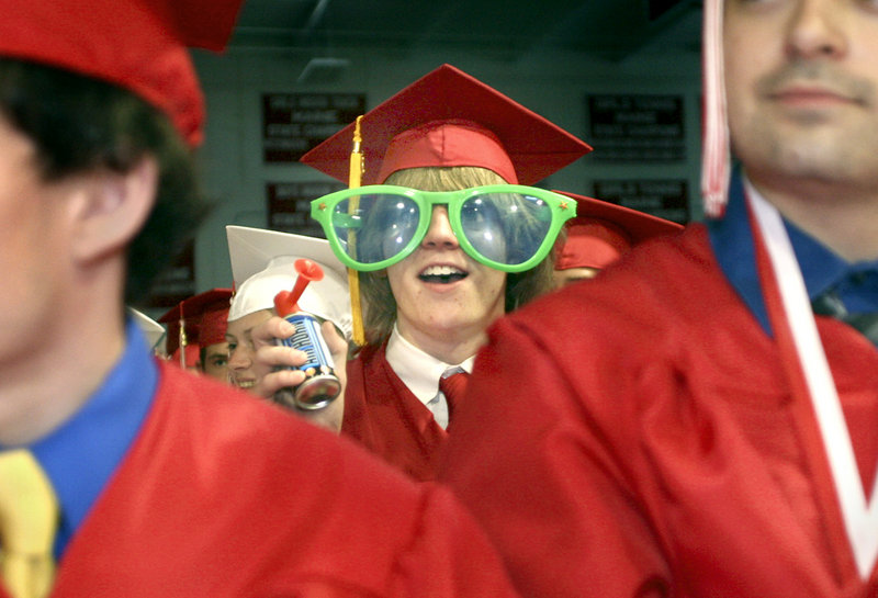 Tyler Wilburn cheers on a fellow graduate during the presentation of diplomas. Some 196 South Portland High seniors were in line to graduate.