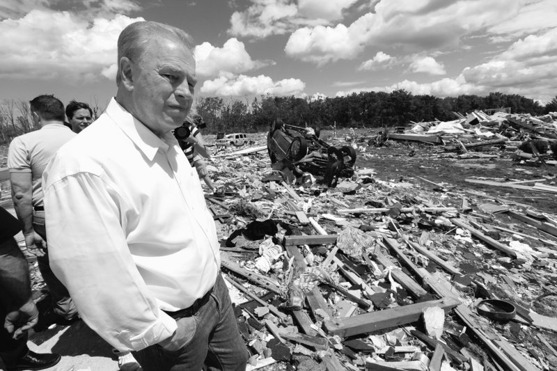 Ohio Gov. Ted Strickland views tornado damage in Millbury, Ohio, on Sunday. Authorities said tornadoes and thunderstorms that swept through the Midwest overnight killed at least seven people, destroyed dozens of homes and damaged a high school gymnasium where graduation was to be held Sunday. The valedictorian’s father was killed.