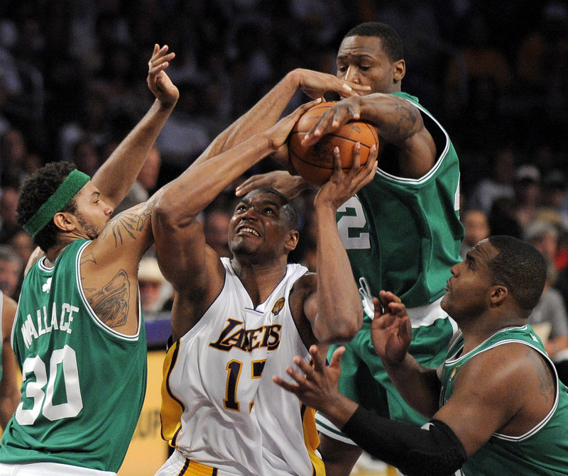 Rasheed Wallace, left, Tony Allen, back, and Glen Davis defend against Lakers center Andrew Bynum during Game 2 of the NBA finals Sunday in Los Angeles. The Celtics tied the series with a 103-94 win, and now head back to Boston for the next three games.