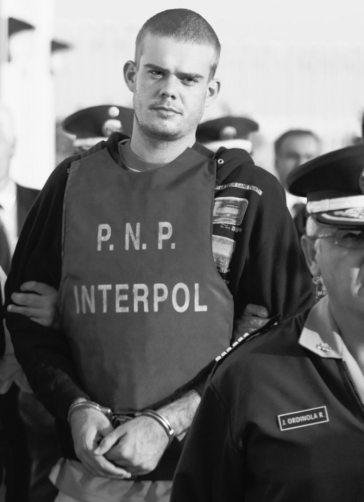 Joran van der Sloot is escorted by police in Tacna, Peru, on Friday. Chilean police turned over van der Sloot, a suspect in the killing of 21-year-old Stephany Flores, to Peruvian police at the countries’ border.