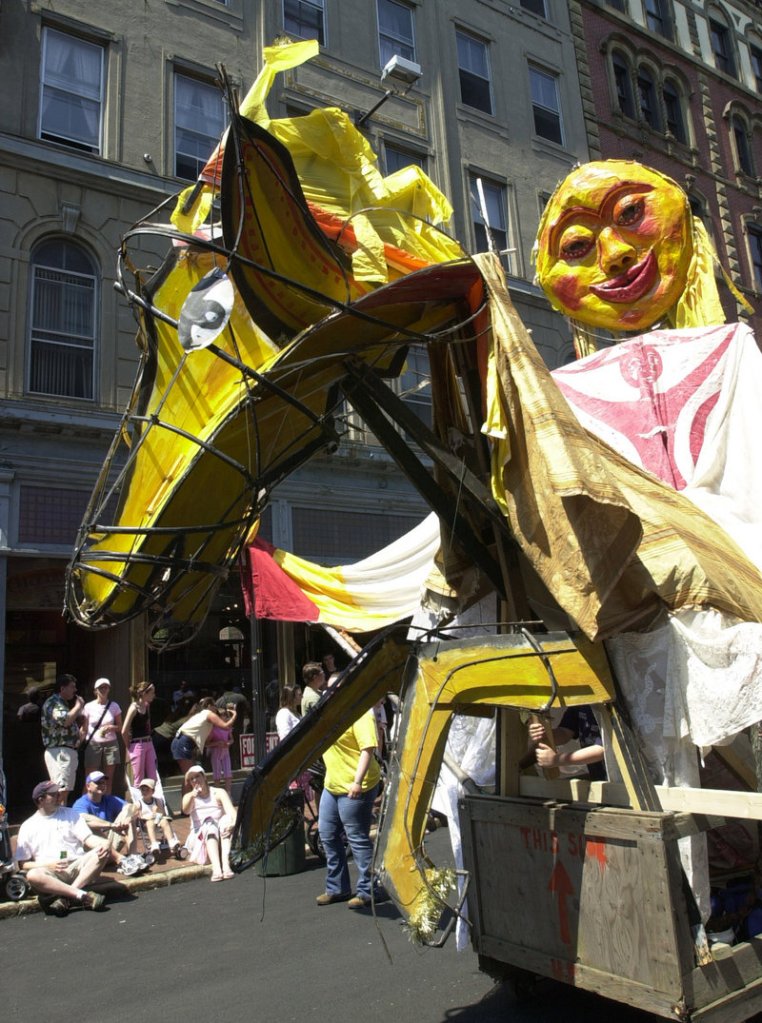 Puppets prance in the parade of an Old Port Festival past.