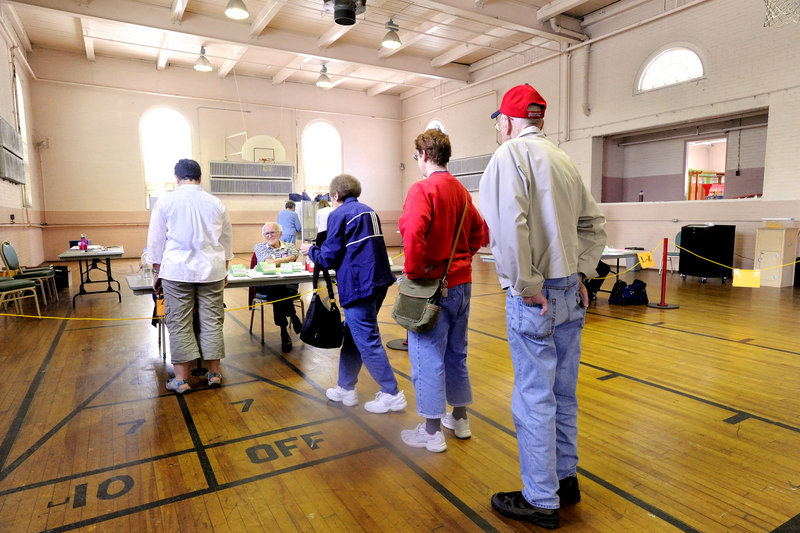 Voters line up at the polls at Portland's Woodfords Street Church on Tuesday.