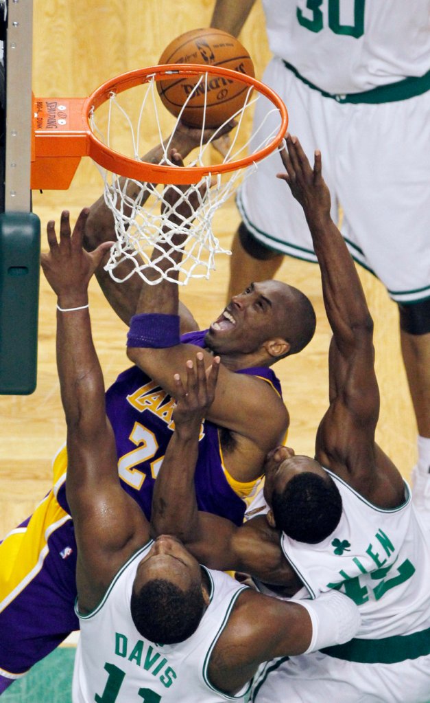 Kobe Bryant of the Los Angeles Lakers finds room to shoot Tuesday night against Glen Davis and Tony Allen of the Boston Celtics. Bryant scored 29 points in a 91-84 victory.